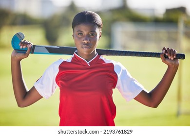 Hockey Player Or Coach Holding Stick Ready For A Competition Or Match On The Sports Ground Or Field. Portrait Of A Serious, Fit And Active Black Woman Athlete At Fitness Training, Exercise 