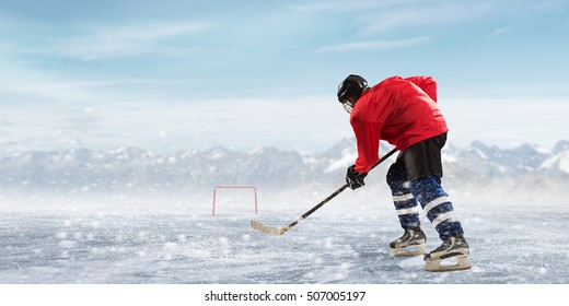 Hockey player on the ice . Mixed media