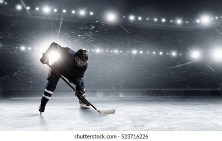 Hockey player on the ice . Mixed media