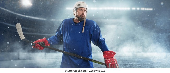  Hockey player on ice rink in sport arena field - stadium. Ready to shoot goal. - Powered by Shutterstock