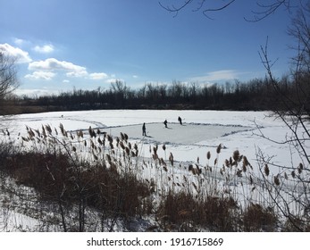 Hockey Players Enjoy A Game Of Shinny On The Pond.