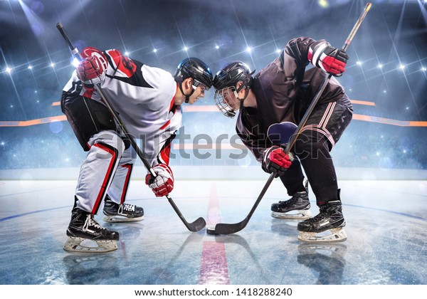 Hockey\
players starts game. around Ice rink arena\
