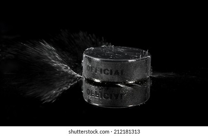 hockey puck on a black background 