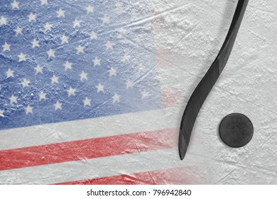 Hockey puck, stick and the image of the American flag on the ice. Concept, hockey