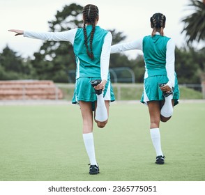 Hockey, sports or team stretching legs in training, practice or fitness workout exercise on turf together. Teamwork, back or healthy athletes women with flexibility ready to start a game in warm up - Powered by Shutterstock