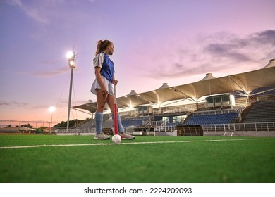 Hockey, stadium and woman sports training, thinking of game strategy and goal fitness health on green pitch field with sunset sky. Young teenager or athlete girl with training gear for competition - Powered by Shutterstock