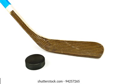 Hockey stick and puck. Isolated on white background