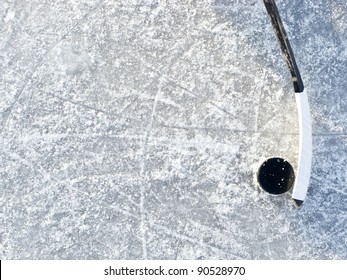 Hockey Stick And Puck On Ice