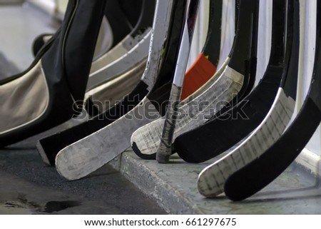 Hockey sticks near the locker room before the game