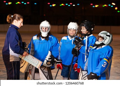 Hockey Team Listens To Coach Explaining Game Plan