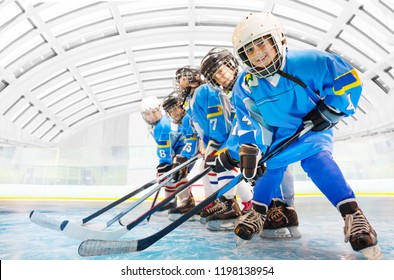 Hockey Teammates Standing In Line On Ice Rink