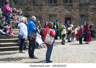 Hoghton, Lancashire/UK - May 5th 2019: The Mummers Play Performed In A Tudor Courtyard By A Street Theatre Group Of Amateur Actors With People Watching