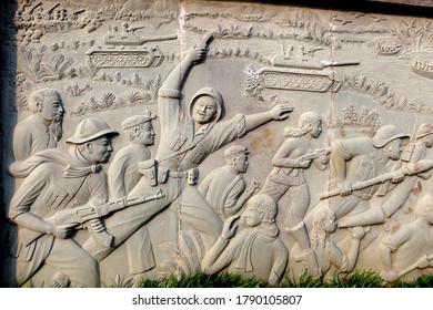 Hoi An, Vietnam, February 29, 2020: Detail Of A Mural In Relief Depicting A Battle Of The Vietnam War In The Martyrs' Cemetery In Hoi An, Vietnam.