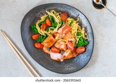 Hoisin Salmon With Roast Plum Tomatoes, Broccoli And Egg Noodles - Overhead View