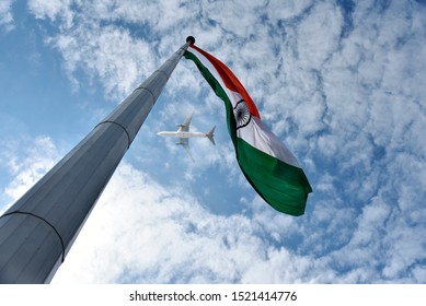 Hoisted Indian National Flag As A Airplane Flying Over It.