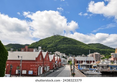 Hokkaido Hakodate Red Brick Warehouse and Mt. Hakodate in Japan - Powered by Shutterstock