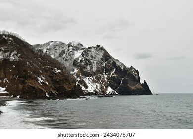 Hokkaido Winter Coast Line near iwainai cloudy rough sea. High quality photo - Powered by Shutterstock