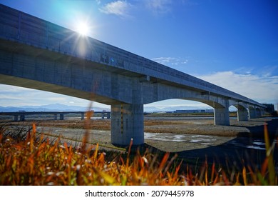 Hokuriku Shinkansen Bridge Over A River In Japan