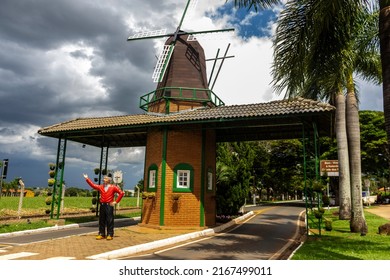 Holambra,Sao Paulo,Brazil. March, 16, 2022.Portal in the city of Holambra. Statue of Piet Schoenmaker, Dutch dance teacher and Expoflora ambassador. Sign in Portuguese: Welcome to the city of Holambra