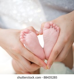 Hold Baby's Foot As Love Heart Shape