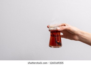 Hold By Hand Turkish Tea, Isolated Turkish Tea By Hand. White Background.