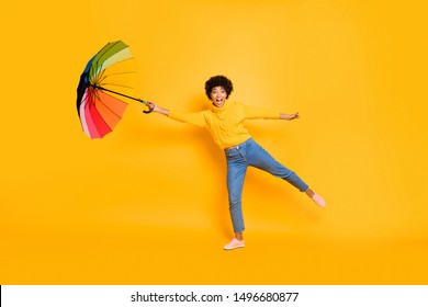 Hold On! Adventures Have Just Begun! Full Body Photo Of Astonished Excited Cheerful Shocked Funky In Jeans People Trying To Hold Umbrella In Hand And Don't Be Blown Away By Wind Isolated Background