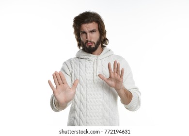 Hold On. Horizontal Portrait Of Displeased Bewildered Young Man Making Stop Gesture With Both Hands, Feeling Indignant, Trying To Sort Out Tricky Situation. Frowning Guy Saying: Stay Away From Me