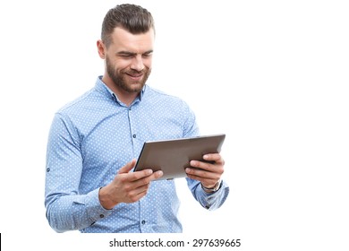 Hold With Smile. Portrait Of Solid Businessman With Beard Standing On White Isolated Background And Holding Tablet.