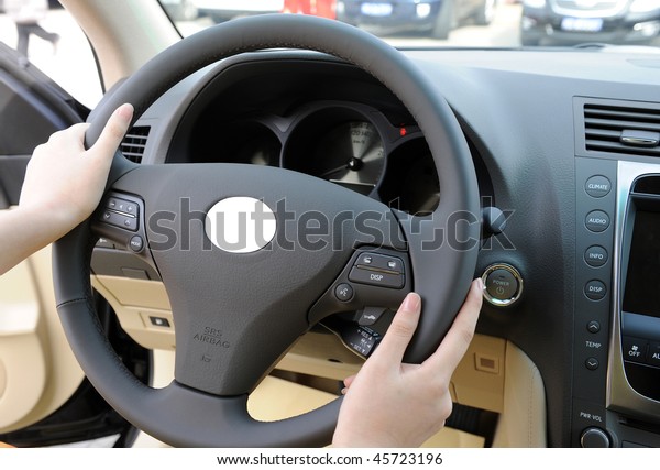 Hold the steering\
wheel with both hands