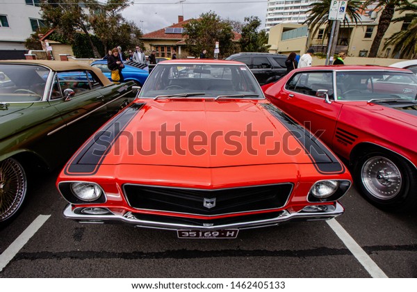 Holden\
classic car, red or orange. Melbourne Car show Father\'s day. St\
Kilda, Victoria, Australia - September 2nd,\
2018.
