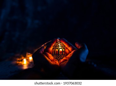 Holding beautiful lantern light lamp, Ramadan Eid al-Fitr concept background