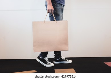 Holding Blank Brown Paper Bag By Hand Man.