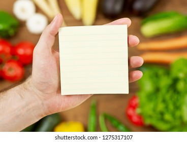 Holding A Blank Groceries List