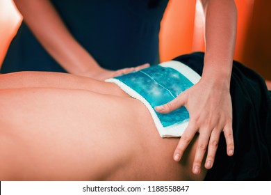 Holding The Blue Ice Pack N The Painful Lower Back.