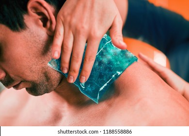 Holding The Blue Ice Pack On The Painful Neck.