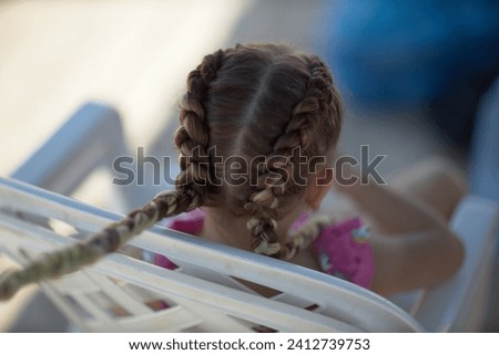 Similar – grandma reading a book to a child