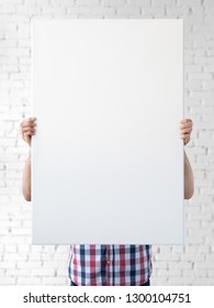 Holding canvas mockup. Photo Mockup. The man hold canvas. For canvas design. Frame size 24x36 (61x91cm).