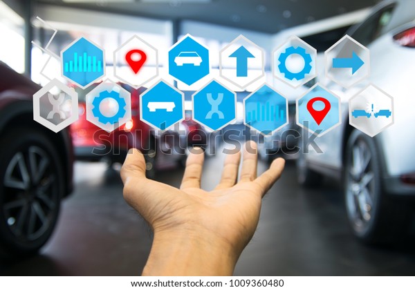 holding car technology digital\
virtual screen icon and Wireless communication connecting internet\
in car technology for transport, automotive, driver\
image.