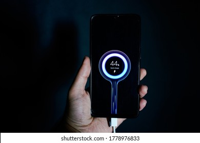 holding charging smartphone quick charge fast charge - Shutterstock ID 1778976833