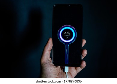 holding charging smartphone quick charge fast charge - Shutterstock ID 1778976836