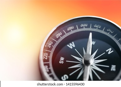 holding compass on tree mountain and sea blurry background. Using wallpaper or background travel or navigator image. - Shutterstock ID 1415596430