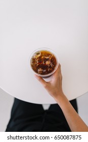 Holding A Cup Of Iced Coffee