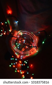 Holding a glass with a light string in it
