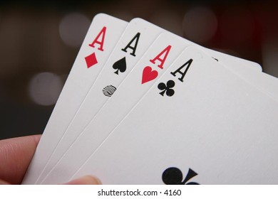 holding a hand of cards