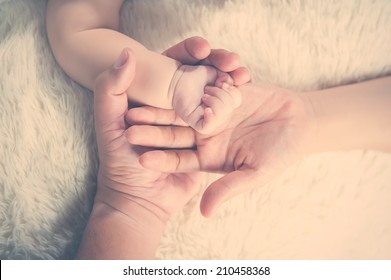 Holding Hands. Concept Of Love And Family. Hands Of Mother, Father And Baby Closeup