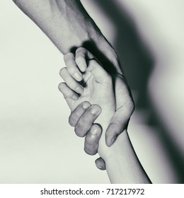 Holding Hands For Helping Drug Addict Teenage On White Background. Stop Drug Addiction By Rehabilitation In Rehab Center Concept. International Day Against Drug Abuse.