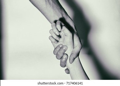 Holding hands for helping drug addict teenage on white background. Stop drug addiction by rehabilitation in rehab center concept. International Day against Drug abuse.