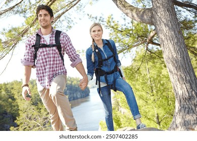 Holding hands, nature or happy couple hiking by river for travel, outdoor adventure or journey. Mountain, woods or people in forest together on holiday vacation, lake trip or break to explore park - Powered by Shutterstock