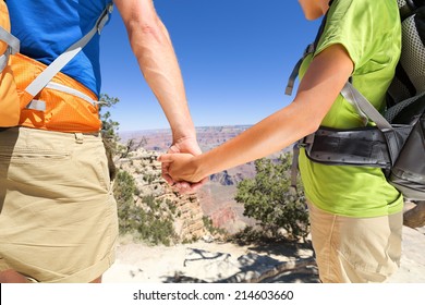 Holding Hands - Romantic Couple Hiking Grand Canyon. Close Up Of Young Lovers On Hike Enjoying View And Romance. Woman And Man Hikers In Love.