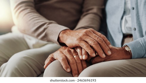 Holding hands, senior and couple with support in living room, empathy and love with care on couch. Lounge, marriage and people, elderly and retirement in house or apartment with compassion in home - Powered by Shutterstock